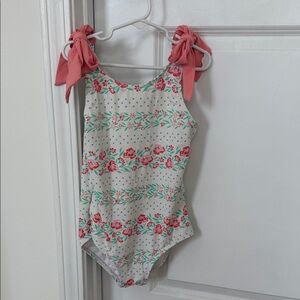 The Beaufort Bonnet Company Floral Swimsuit with Pink bows.